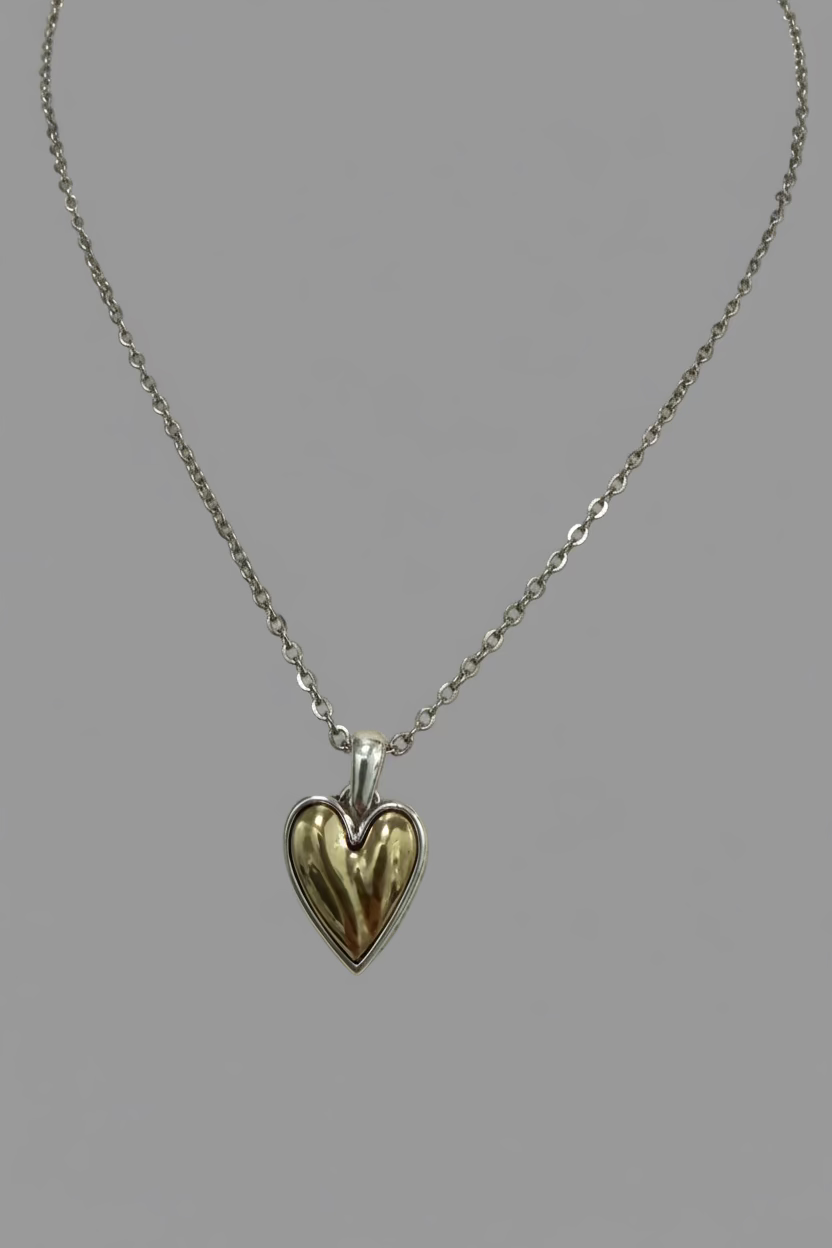 Heart-shaped pendant necklace on a mannequin bust