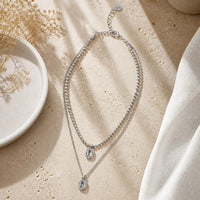 Chandeliers Boutique ny Double Dare You double-strand silver-plated necklace with crystal pendants on stone surface