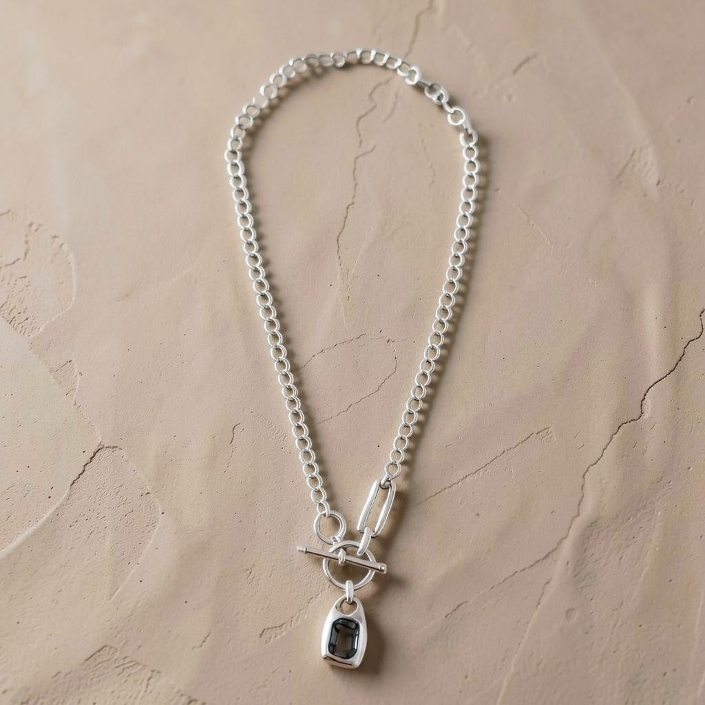 Chandeliers Boutique ny pewter toggle necklace featuring a silver-tone chunky link chain and dark rectangular pendant