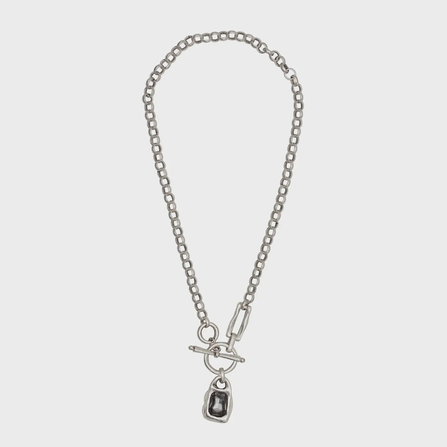 Chandeliers Boutique ny pewter toggle necklace with a chunky silver-tone link chain and dark rectangular pendant.