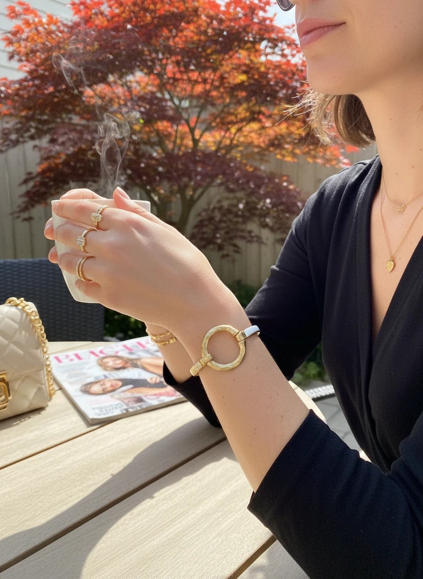 Chandeliers Boutique ny silver plated cuff bracelet with hammered gold tone circle and hook closure, 1 1/2" wide.